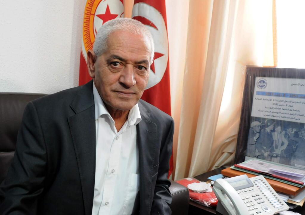 Houcine Abassi, secretary general of the Tunisian General Labour Union (UGTT), poses for a photograph in his office at the headquarters in Tunis, Tunisia, Friday, Oct. 9, 2015. Abassi is one of the four members of the Tunisian National Dialogue Quartet to be awarded the 2015 Nobel Peace Prize on Friday by the Norwegian Nobel Committee. (AP Photo)