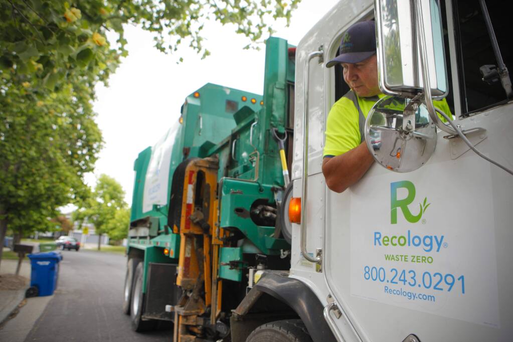 Recology is the new trash collection company in Petaluma. Driver Louie Seidner makes his rounds in an East Petaluma neighborhood. (CRISSY PASCUAL/ARGUS-COURIER STAFF)