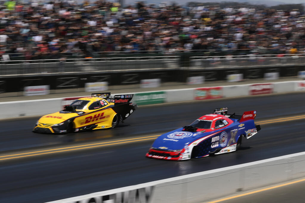 Funny car drivers Robert Hight, right, and J.R. Todd, left, compete during the NHRA Sonoma Nationals at Sonoma Raceway in Sonoma, Calif., on Sunday, July 25, 2021.(Beth Schlanker/The Press Democrat)