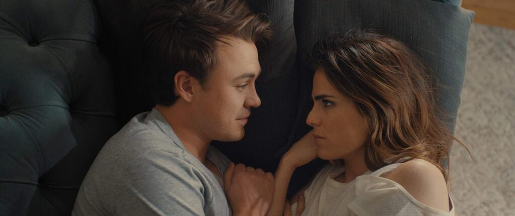 Karla Souza stars as Clara, a busy OB-GYN in Los Angeles who must choose between an old boyfriend and a co-worker (Ben O'Toole, pictured) with the added pressure from her family in 'Everybody Loves Somebody.' (Pantelion Films)