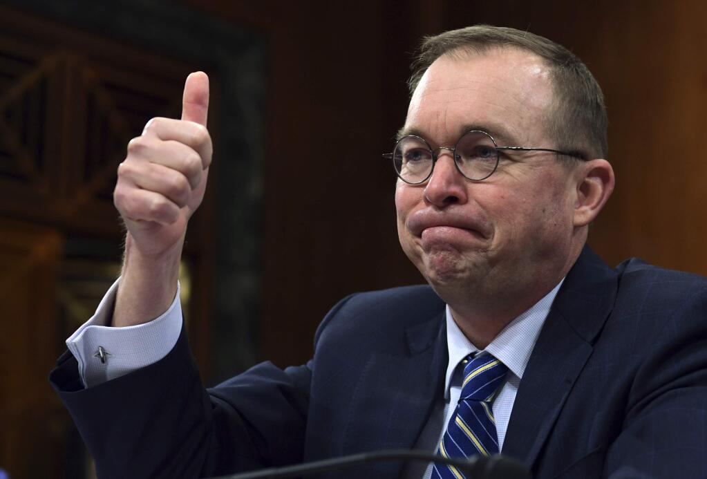 In this Feb. 13, 2018, photo, budget director Mick Mulvaney testifies before the Senate Budget Committee on Capitol Hill in Washington. The Trump administration is pushing a “bold new approach to nutrition assistance: ” Replacing the traditional cash on a card that food stamp recipients currently get with a pre-assembled box of canned foods and other shelf-stable goods dubbed “America's Harvest Box.” Mulvaney likened the box to a meal kit delivery service, and said the plan could save nearly $130 billion over ten years. The idea, tucked into President Donald Trump's 2019 budget, has caused a firestorm, prompting scathing criticism from Democrats and food insecurity experts who say its primary purpose is to punish the poor. (AP Photo/Susan Walsh)