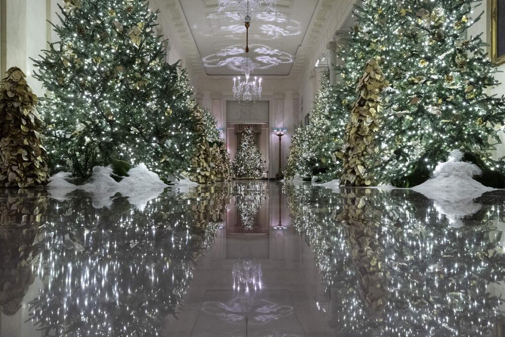 The Cross Hall leading into the State Dinning Room is decorated during the 2019 Christmas preview at the White House, Monday, Dec. 2, 2019, in Washington. (AP Photo/Alex Brandon)