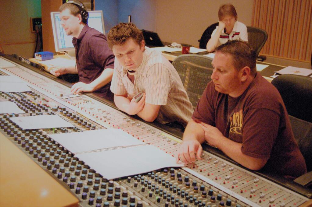 Composer Jonathan Beard works with his team at a scoring session.Photographer credit: Kevin Porter