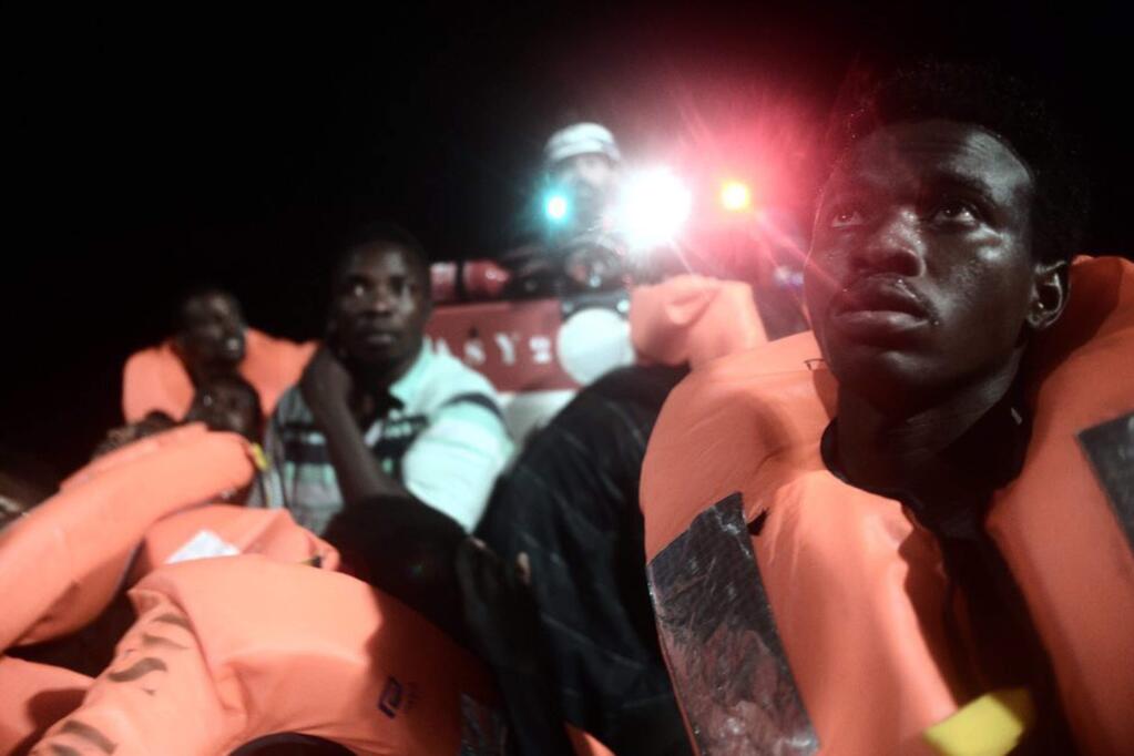 This undated photo released by by French NGO 'SOS Mediterranee' on Monday June 11, 2018 and posted on it's Twitter account, shows migrants aboard SOS Mediterranee's Aquarius ship and MSF (Doctors Without Borders) NGOs, in the Mediterranean Sea. Italy and Malta dug in for a second day and refused to let the rescue ship Aquarius with 629 people aboard dock in their ports, leaving the migrants at sea as a diplomatic standoff escalated under Italy's new anti-immigrant government. (Kenny Karpov/SOS Mediterranee via AP)