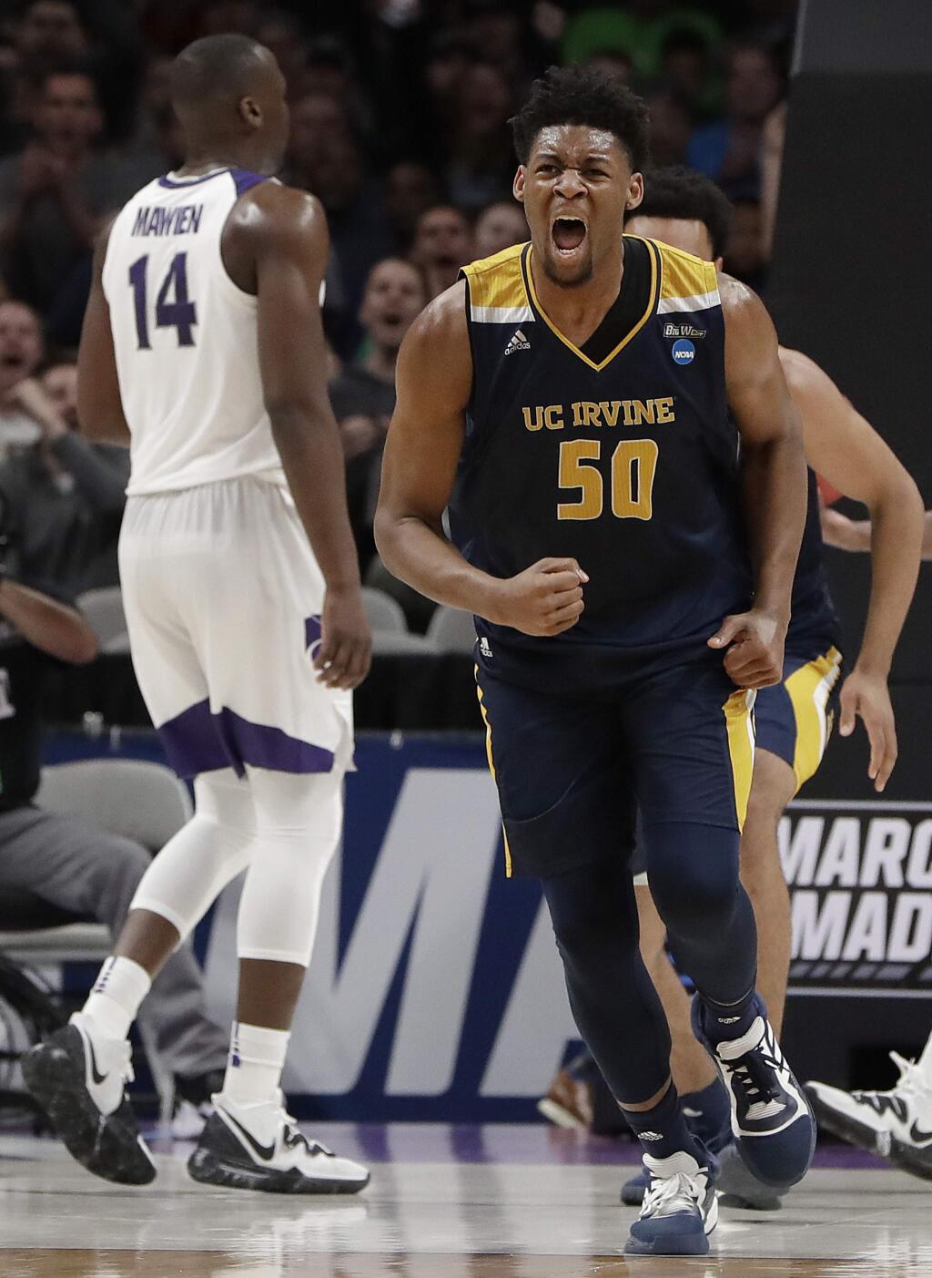 UC Irvine forward Elston Jones, right, reacts after scoring against Kansas State during the first half of a first-round game in the NCAA Tournament Friday, March 22, 2019, in San Jose. (AP Photo/Chris Carlson)