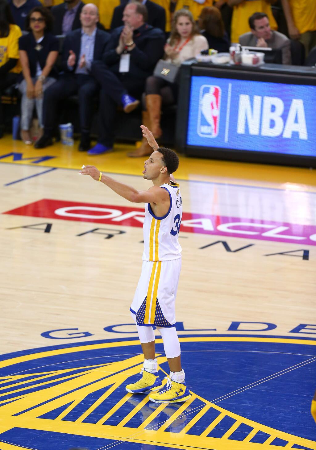 Golden State Warriors guard Stephen Curry gets the crowd going during Game 1 of the NBA Finals at Oracle Arena, in Oakland on Thursday, June 4, 2015. The Warriors defeated the Cavaliers 108-100 in overtime.(Christopher Chung/ The Press Democrat)