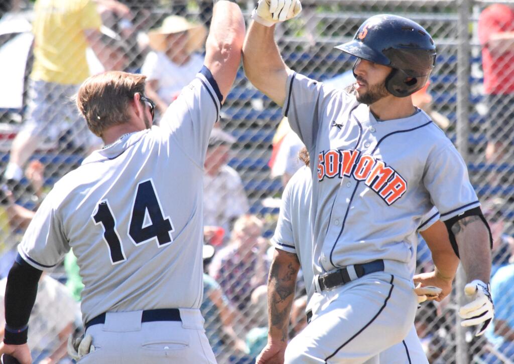 James W. Toy III/Sonoma StompersSonoma's Scott David, left, and Brennan Metzger celebrate Sunday after a Metzger home run. Both Metzger and David hit homers in Sunday's 6-4 win over the Vallejo Admirals. The Stompers and Admirals are tied for first with three games to play in the Pacific Association season.