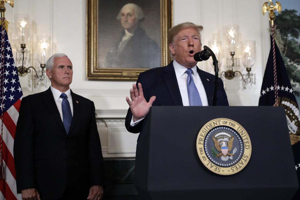 President Donald Trump speaks about the mass shootings in El Paso, Texas and Dayton, Ohio, in the Diplomatic Reception Room of the White House, Monday, Aug. 5, 2019, in Washington. Vice President Mike Pence is left. (AP Photo/Evan Vucci)