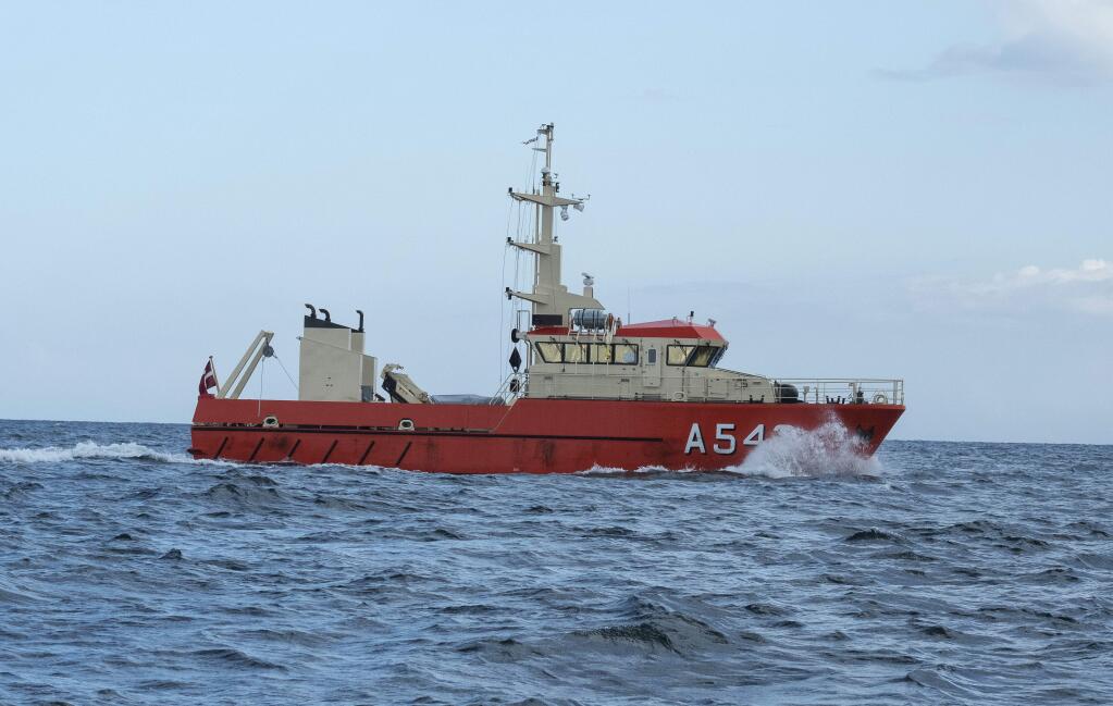 The Danish navy's ship 'Fyrholmen' in Koge Bay, South of Copenhagen, during the continuing search for Swedish journalist Kim Wall, Monday, Aug. 21. 2017. The owner of a home-built submarine has told investigators that a missing Swedish female journalist died onboard in an accident and he buried her at sea in an unspecified location, Danish police said Monday. (Per Rasmussen/Ritzau Foto via AP)