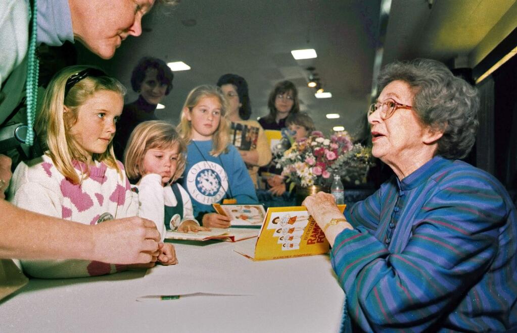 In this April 19, 1998 photo, Beverly Cleary signs books at the Monterey Bay Book Festival in Monterey, Calif. (Vern Fisher/Monterey Herald via AP)