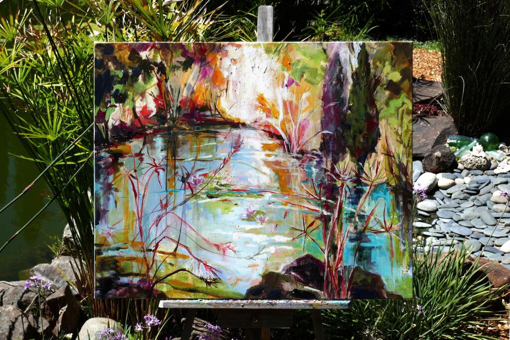 On an easel before her garden pond in Sebastopol is a painting that Carole Watanabe is creating as a gift for a health care professional at Santa Rosa Memorial Hospital. (Don Watanabe)