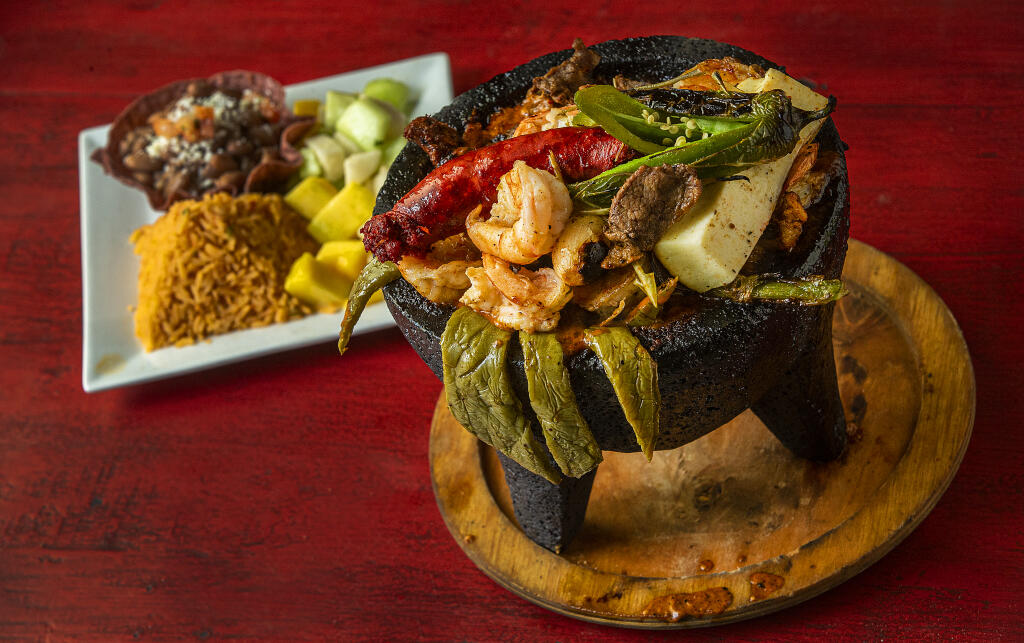 Molcajete Mixto with carne asada, grilled chicken, shrimp, chorizo, cactus, Cambray onions and grilled queso panela from Los Molcajetes Bar & Grill in Rincon Valley on Wednesday, Sept. 9, 2020. (John Burgess / The Press Democrat)