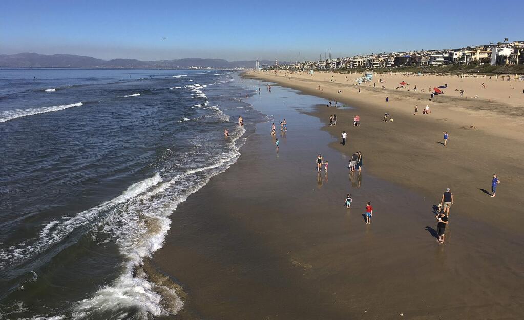 Clear skies are seen in Manhattan Beach, Calif., Sunday, Jan. 28, 2018. Powerful winds are whipping through Southern California amid a winter heat wave that's bringing increased fire danger. Forecasters said Sunday that the hot, dry air will drop humidity levels into the single digits in much of greater Los Angeles. Temperatures are expected in the 80s. (AP Photo/John Antczak)