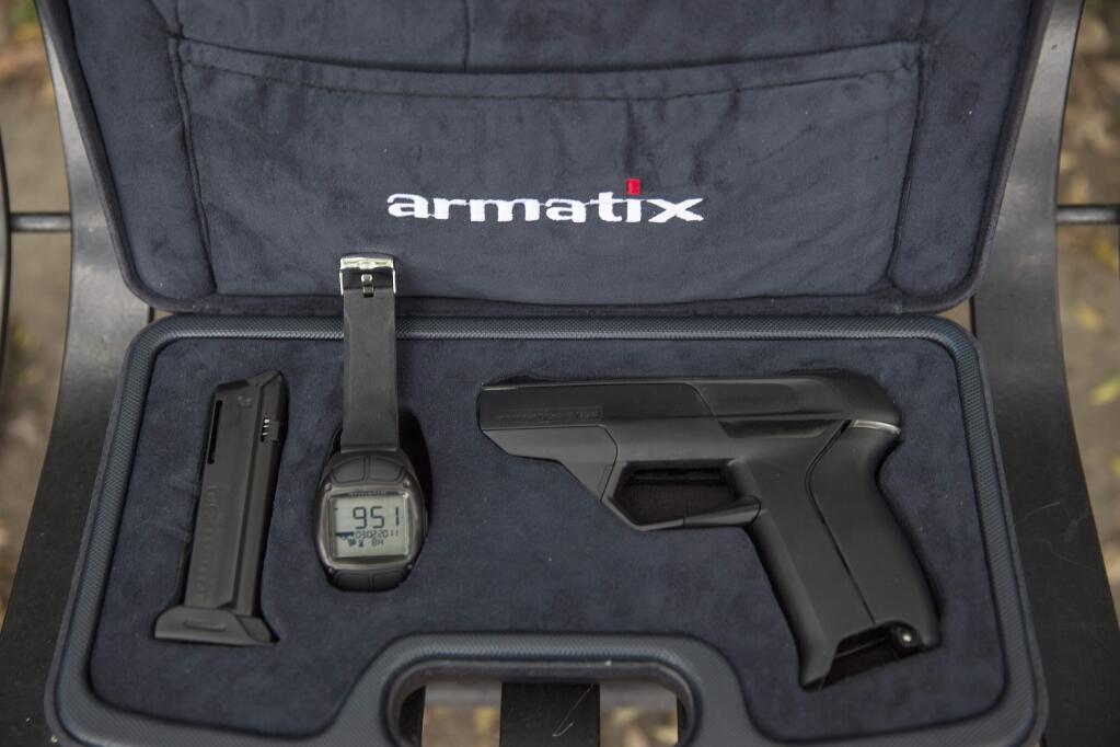 A mock-up of the Armatix iP1 pistol, which was intended to be the first 'smart gun' for sale in America. The handgun uses a radio frequency-enabled stopwatch to identify its user so no one else can fire it, but it has met with the same uproar that has stopped many seeking tougher weapons laws. (MONICA ALMEIDA / New York Times, 2014)
