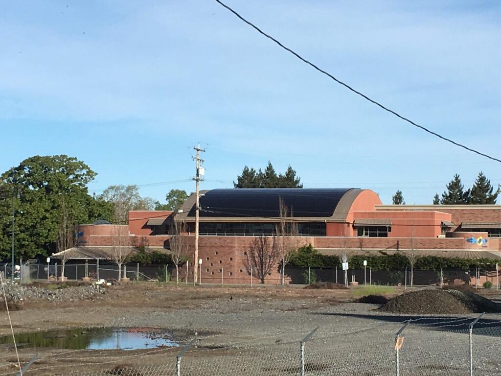 One hundred and twenty-one solar panels, totaling 38 kilowatts, were installed on the curved center roof of the Chops Teen Club in Santa Rosa by Pure Power Solutions. These panels are linked to a battery bank that stores energy for use by this organization. (courtesy of Pure Power Solutions)