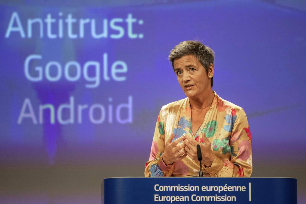 EU Commissioner Margrethe Vestager holds a press conference on a Competition Case involving Google Android at the European Commission building, in Brussels on Wednesday, July 18, 2018. he European Union's antitrust chief has fined Google a record $5 billion for abusing the market dominance of its Android mobile phone operating system. (AP Photo/Olivier Matthys)