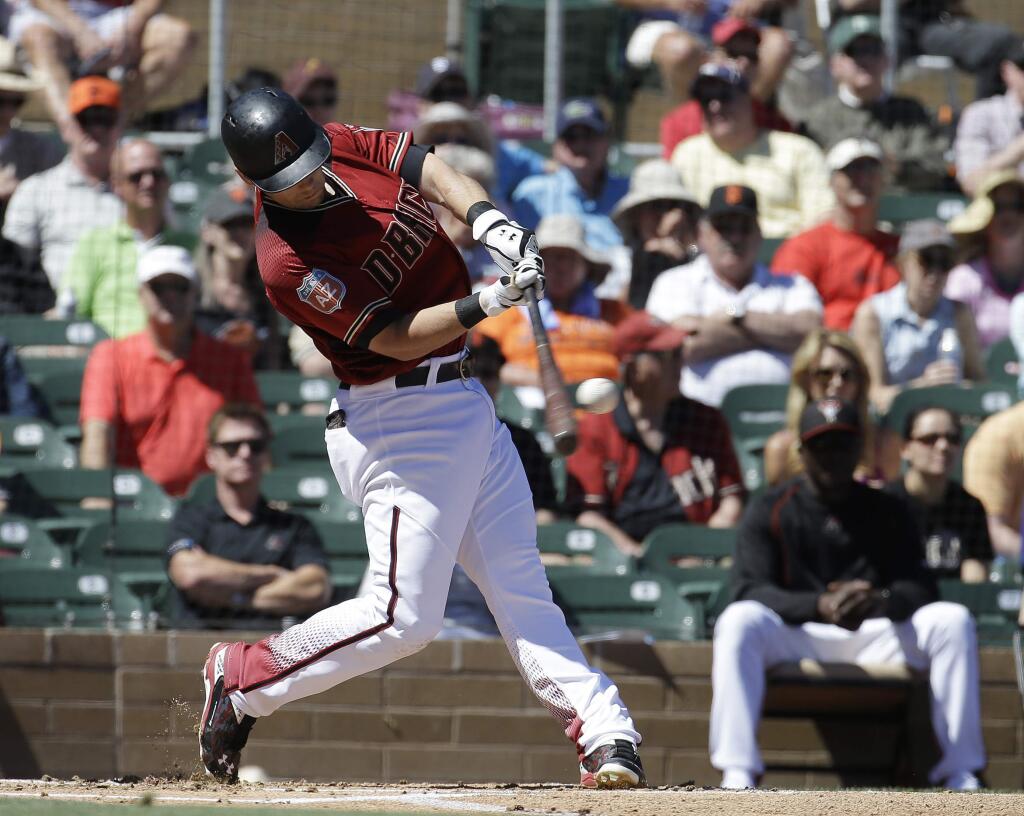 Arizona Diamondbacks' Chris Owings hits a solo home run against the San Francisco Giants during the first inning of a spring training baseball game Wednesday, March 23, 2016, in Scottsdale, Ariz. (AP Photo/Darron Cummings)
