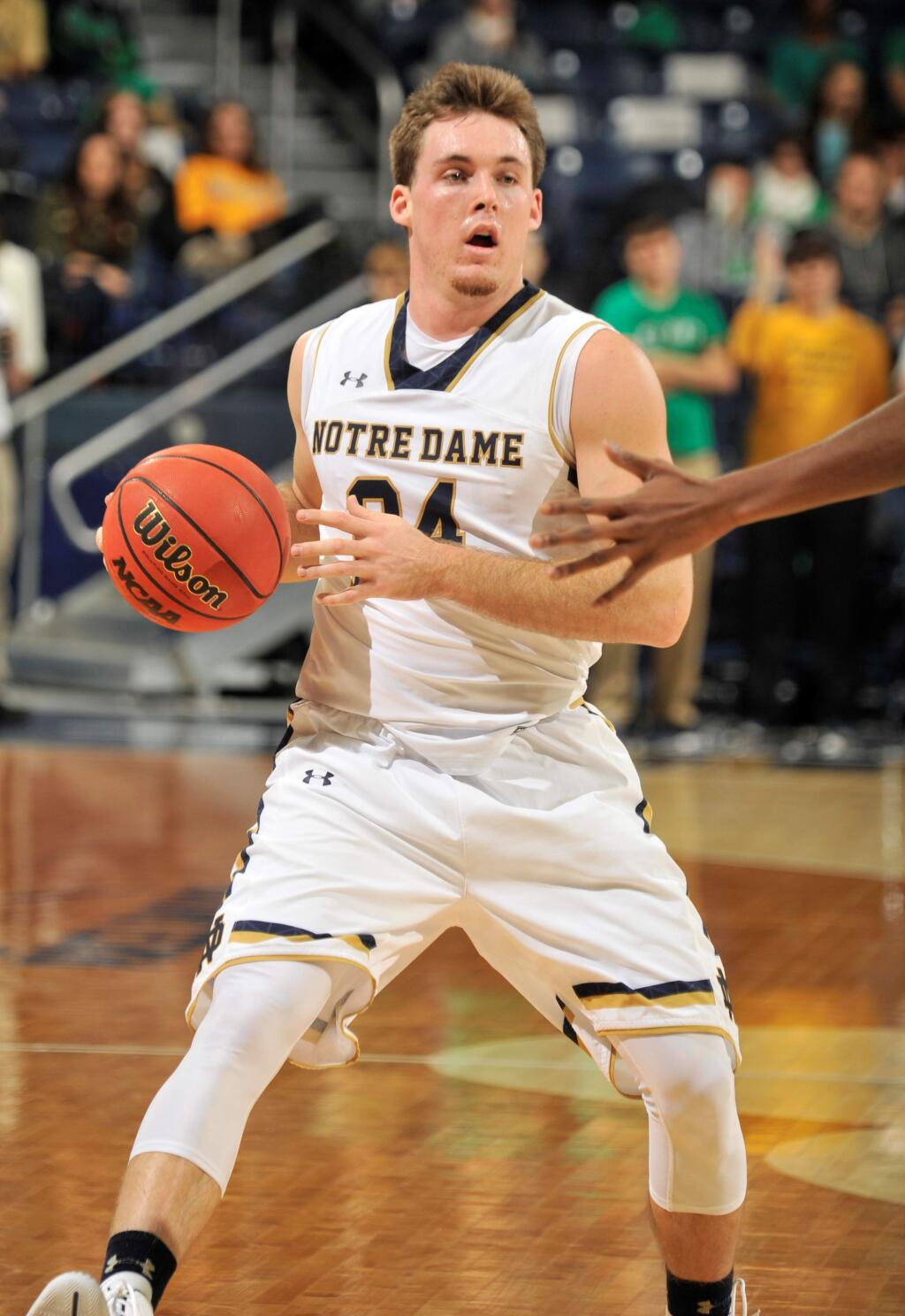 Notre Dame guard Pat Connaughton heads up court in an NCAA basketball game Wednesday Nov. 19, 2014 in South Bend, Ind. (AP Photo/Joe Raymond)