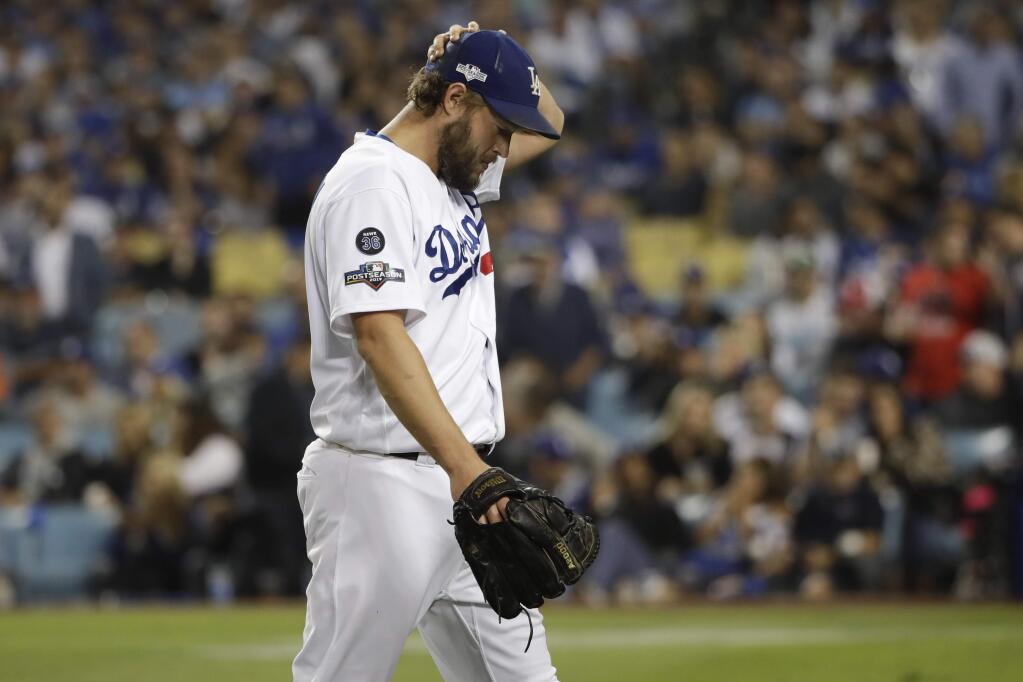 Los Angeles Dodgers pitcher Clayton Kershaw leaves after giving up back-to-back home runs to the Washington Nationals during the eighth inning in Game 5 of a baseball National League Division Series on Wednesday, Oct. 9, 2019, in Los Angeles. (AP Photo/Marcio Jose Sanchez)