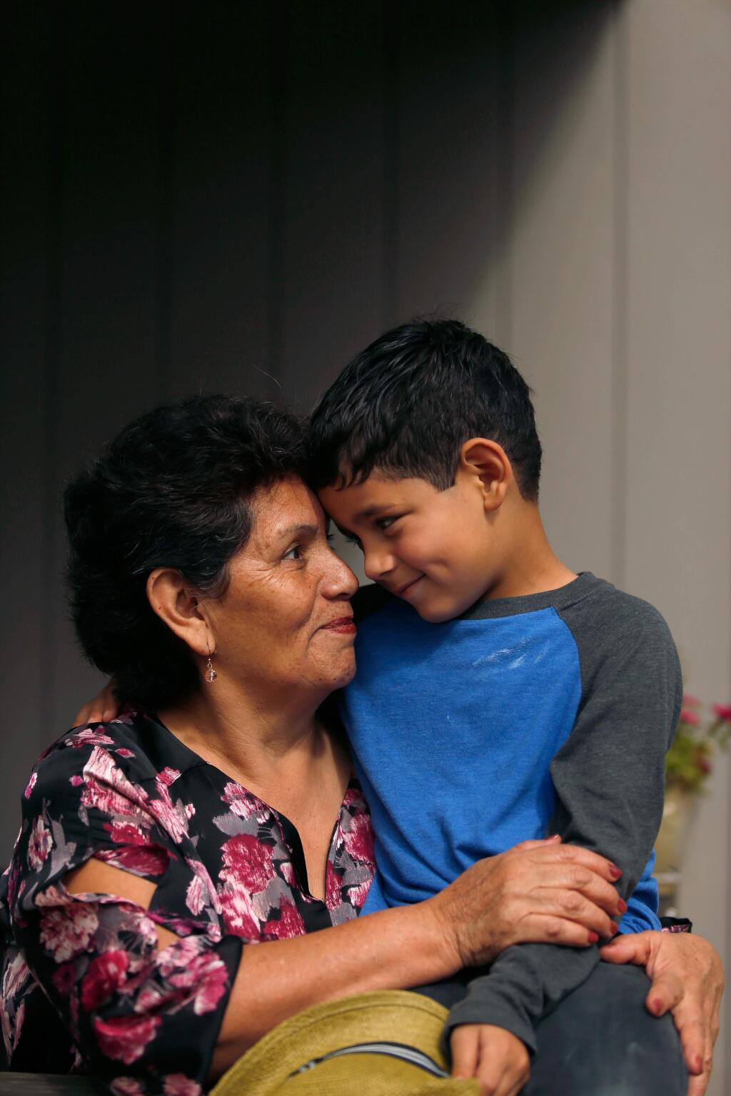 Rosa Mendoza, 60, smiles with her grandson Diego Camargo, 6, at their home, where multiple generations of the tight-knit Mendoza family live under one roof, in Cotati, California on Thursday, April 21, 2016. (Alvin Jornada / The Press Democrat)