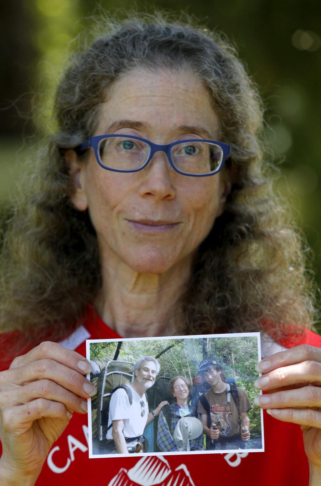 Jeanette Lebell holds a photograph of herself with her late husband Jan Zlotnick and her son Quincy on a trip to Point Reyes National Seashore. Photo taken in Sebastopol, on Thursday, June 2, 2016. (BETH SCHLANKER/ The Press Democrat)