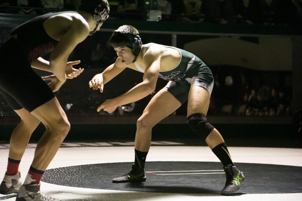 DRAGON WRESTLER Noah Bartolome continues to score victories against his SCL opponents, as in this recent match against Healdsburg in Golton Hall. (Photo by Julie Vader/Special to the Index-Tribune)