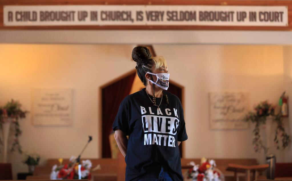 Sydni Locke-Davenport inside the chapel of New Beginnings Ministry Of Love on South Wright Road in Santa Rosa, Wednesday, June 17, 2020. Locke-Davenport's grandmother Marteal Perry who helped to organize the church, started Santa Rosa's Juneteenth celebration in 1954. (Kent Porter / The Press Democrat) 2020