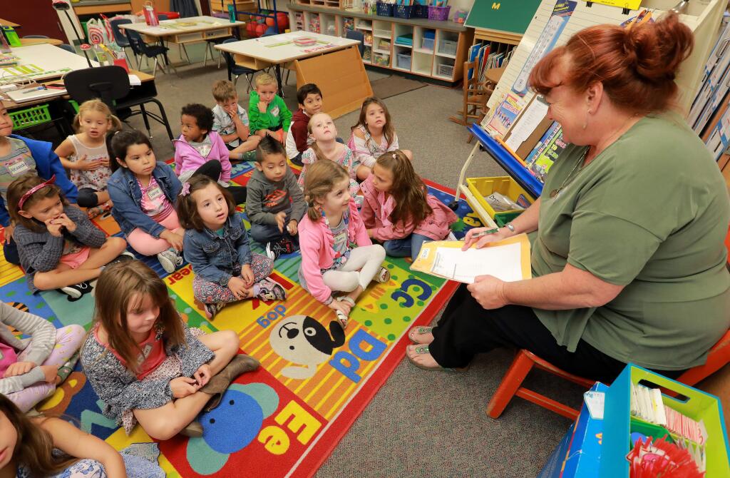 Mrs. Nelson takes attendance in her kindergarten class on the first day of school at Hidden Valley Elementary School in Santa Rosa. (JOHN BURGESS / The Press Democrat)
