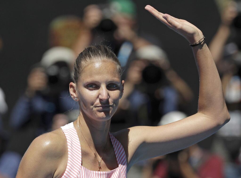 Karolina Pliskova of the Czech Republic waves after defeating United States' Serena Williams in their quarterfinal match at the Australian Open tennis championships in Melbourne, Australia, Wednesday, Jan. 23, 2019. (AP Photo/Kin Cheung)
