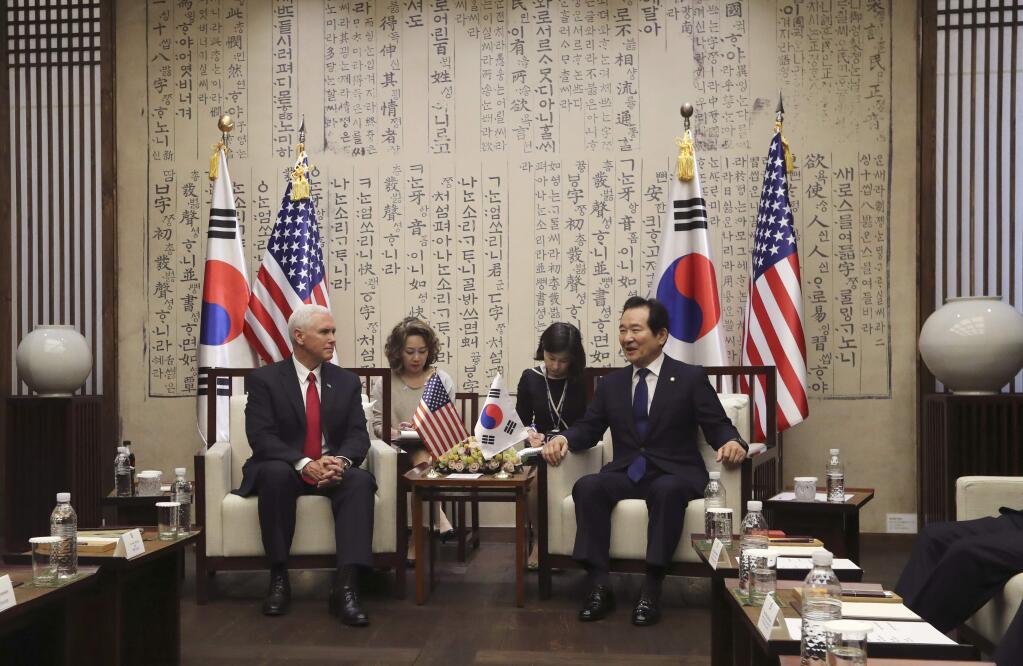 U.S. Vice President Mike Pence, left, talks with South Korea's National Assembly Speaker Chung Sye-kyun, right, during their meeting at the National Assembly in Seoul, South Korea, Monday, April 17, 2017. Pence traveled to the tense zone dividing North and South Korea and warned Pyongyang that after years of testing the U.S. and South Korea with its nuclear ambitions, 'the era of strategic patience is over.' (AP Photo/Lee Jin-man)