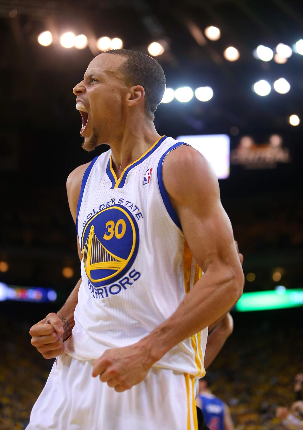 Golden State Warriors guard Stephen Curry lets out a yell after blocking a shot attempt by Los Angeles Clippers guard J.J. Redick during Game 4 in Oakland on Sunday, April 27, 2014. The Warriors defeated the Clippers 118-97(Christopher Chung/ The Press Democrat)