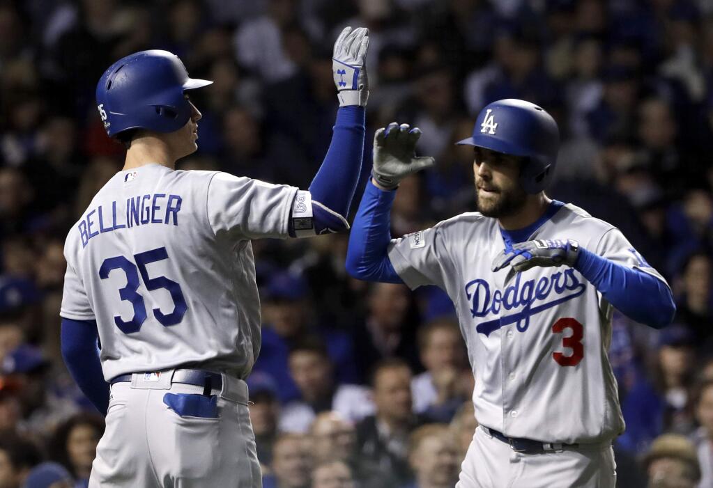 The Los Angeles Dodgers' Chris Taylor, right, celebrates his home run with Cody Bellinger during the third inning of Game 3 of the National League Championship Series against the Chicago Cubs, Tuesday, Oct. 17, 2017, in Chicago. (AP Photo/Matt Slocum)