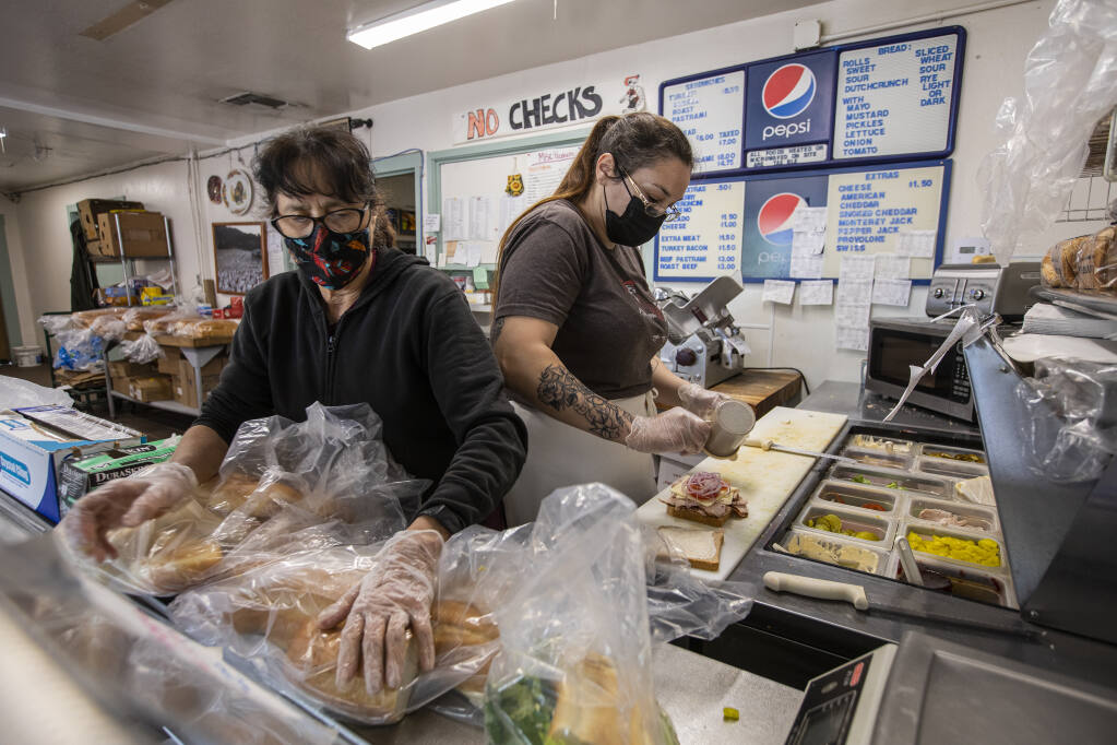 Deli manager Linda Gile, left and Stephanie Cycyk make turkey sandwiches during the lunch rush at Willie Bird Turkey Store and Deli in Sebastopol on Friday April 22, 2022. (Chad Surmick / The Press Democrat)