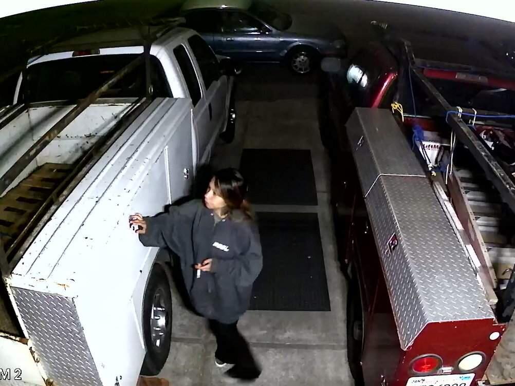 A screen grab from surveillance video showing one of two women police say attempted to break into two work pickups parked in the driveway of a Rohnert Park home on Friday, July 5, 2018. (ROHNERT PARK DEPARTMENT OF PUBLIC SAFETY)