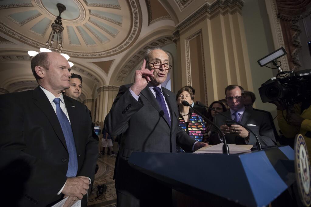 Senate Minority Leader Chuck Schumer, D-N.Y., joined by, from left, Sen. Chris Coons, D-Del., Sen. Brian Schatz, D-Hawaii, and Sen. Jeanne Shaheen, D-N.H., speaks about the health overhaul following a closed-door strategy session at the Capitol in Washington, Tuesday, June 20, 2017. Senate Majority Leader Mitch McConnell says Republicans will have a 'discussion draft' of a GOP-only bill scuttling former President Barack Obama's health care law by Thursday. (AP Photo/J. Scott Applewhite)