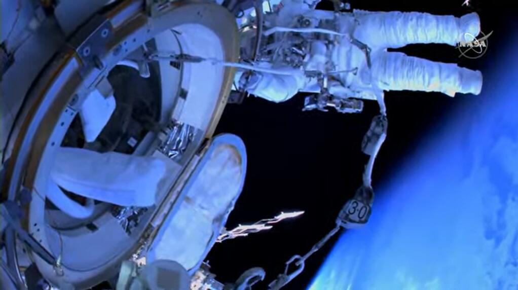 A screenshot from NASA video footage of a spacewalk outside the International Space Station shows Petaluma native Nicole Mann orbiting the Earth more than 250 miles above the planet’s surface on Friday, Jan. 20, 2023. (Image courtesy of NASA)
