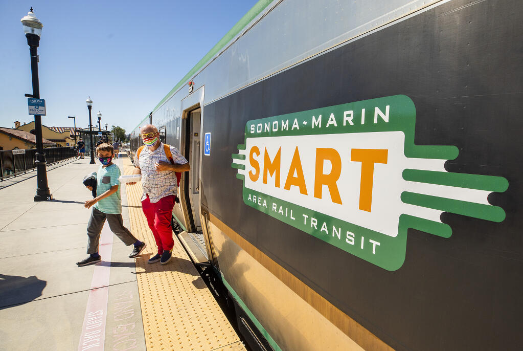 Passengers exit the southbound SMART train at the Petaluma station on Wednesday, June 23, 2021. The SMART train celebrated the 2 millionth passenger to ride the commuter train. (Photo by John Burgess/The Press Democrat)