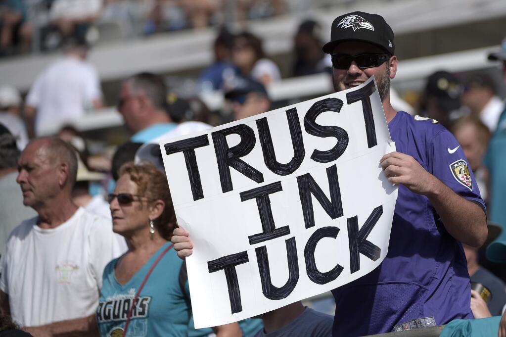 In this Sunday, Sept. 25, 2016, file photo, a Baltimore Ravens fan holds a sign supporting kicker Justin Tucker after Tucker hit a field goal during the second half against the Jacksonville Jaguars in Jacksonville, Fla. The Ravens won 19-17. After scoring a big contract during the offseason, Justin Tucker hasn't missed a kick and has accounted for more than half the Baltimore Ravens' points. (AP Photo/Phelan M. Ebenhack, File)