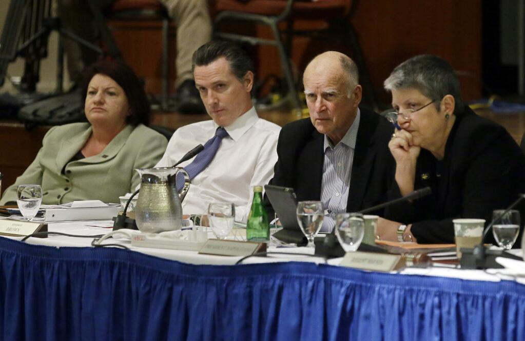 From left to right, State Assembly Speaker Toni Atkins, Lt. Gov. Gavin Newsom, Gov. Jerry Brown, and University of California President Janet Napolitano listen to students speak during the public comments portion of the UC Regents meeting in San Francisco, Thursday, Nov. 20, 2014. The University of California has approved raising tuition by as much as 5 percent in each of the next five years unless the state devotes more money to the 10-campus system. (AP Photo/Eric Risberg)