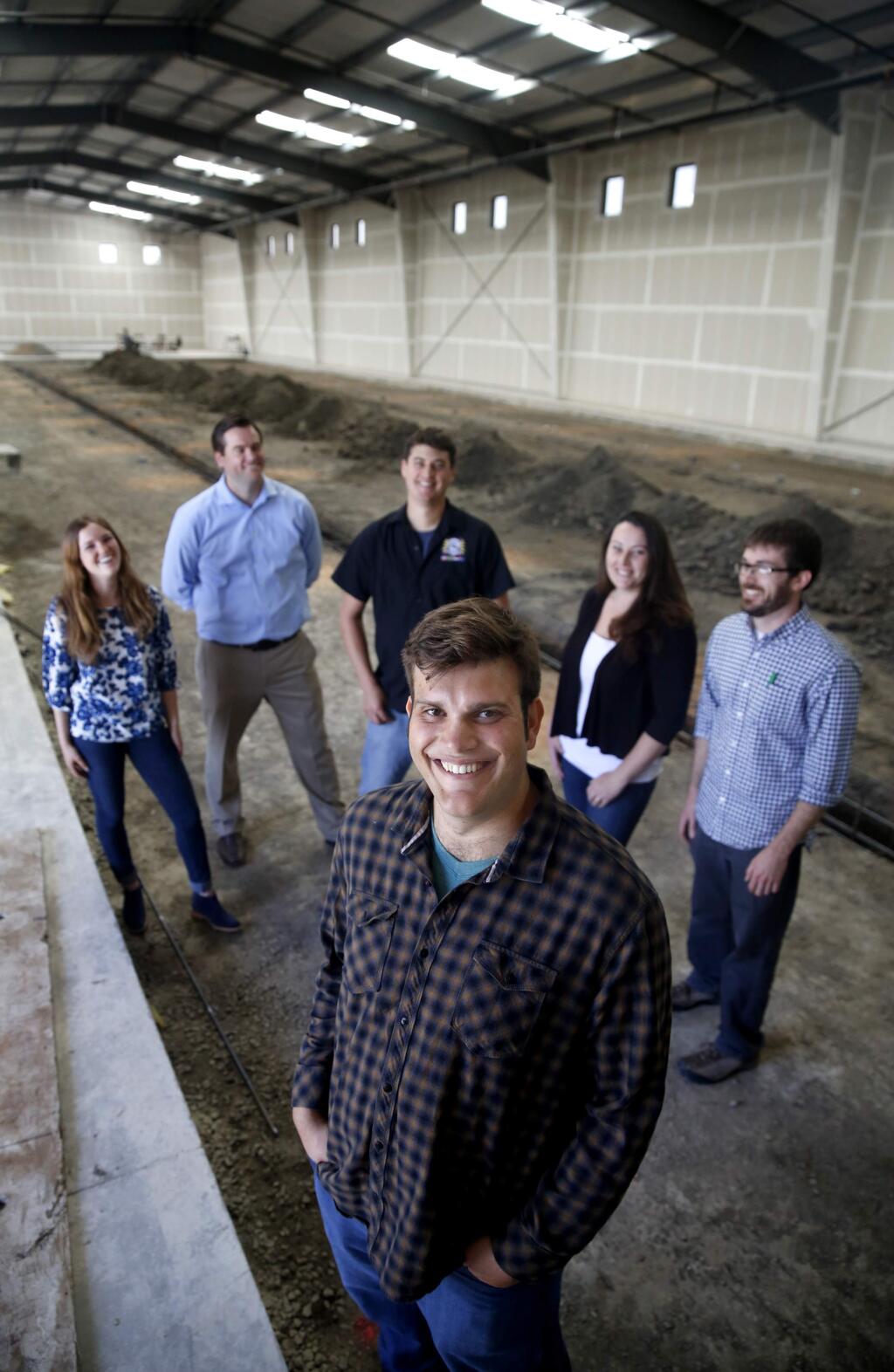 Christopher Jackson, owner of Seismic Brewing Co., with (from left) his wife Ariel, Tom McGinty, Vice President of Sales and Marketing, Andy Hooper, Brewmaster and Director of Operations, his wife Danica Hooper, Director of Accounting and Logistics, and General Manager Patrick Delves at the building which will house Seismic Brewing Co. Photo taken in Santa Rosa, on Thursday, May 26, 2016. (BETH SCHLANKER/ The Press Democrat)