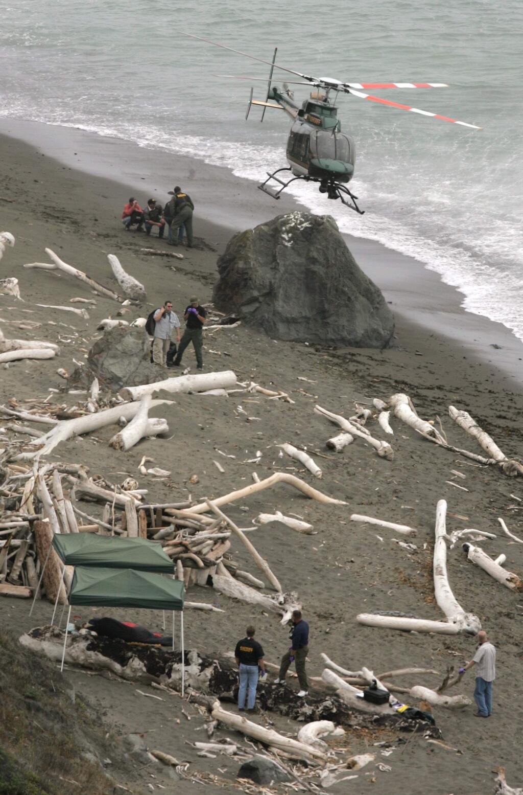 A Sonoma County sheriff's helicopter drops off personnel at Fish Head Beach, north of Jenner, where Lindsay Cutshall and Jason Allen were discovered dead in sleeping bags in 2004. (Christopher Chung / PD, 2004)