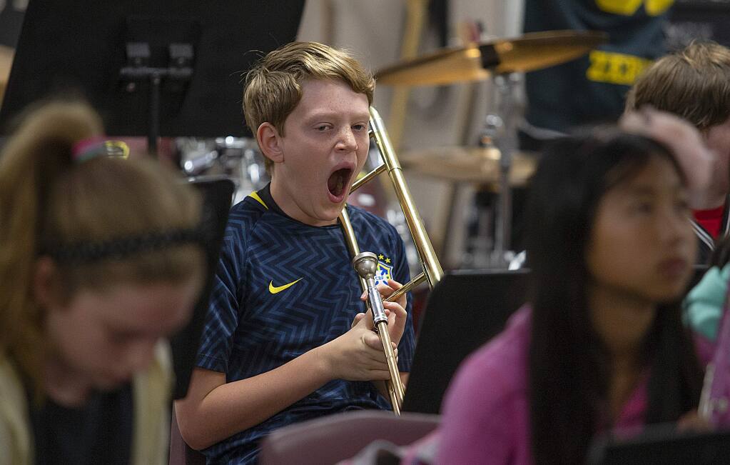 After back to school night on Thursday, zero period Jazz band student Liam Limberg, 11, lets out a long yawn just after 7 a.m. during zero period at Lawrence Jones Middle School in Rohnert Park on Friday. A bill on Gov. Jerry Brown's desk would require 8:30 a.m. start times at many middle and high schools in California but would not impose requirements for zero period. (photo by John Burgess/The Press Democrat)