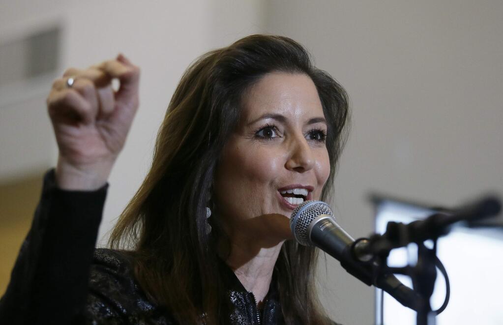 In this March 25, 2017 photo, Oakland Mayor Libby Schaaf gestures during a rally at the Oakland Coliseum in Oakland, Calif. (AP Photo/Eric Risberg)