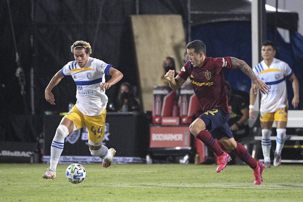 San Jose Earthquakes forward Cade Cowell (44) and Real Salt Lake defender Aaron Herrera (22) compete for a ball during the second half of an MLS soccer match, Monday, July 27, 2020, in Kissimmee, Fla. (AP Photo/Phelan M. Ebenhack)