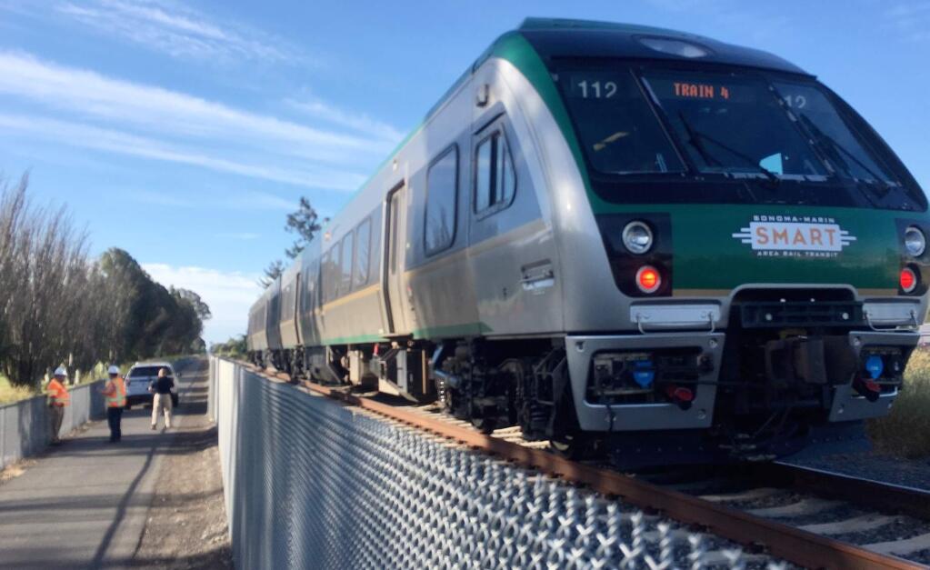 Police investigate the scene where a pedestrian was hit by a SMART train in Rohnert Park on Friday, June 28, 2019. (KENT PORTER/ PD)