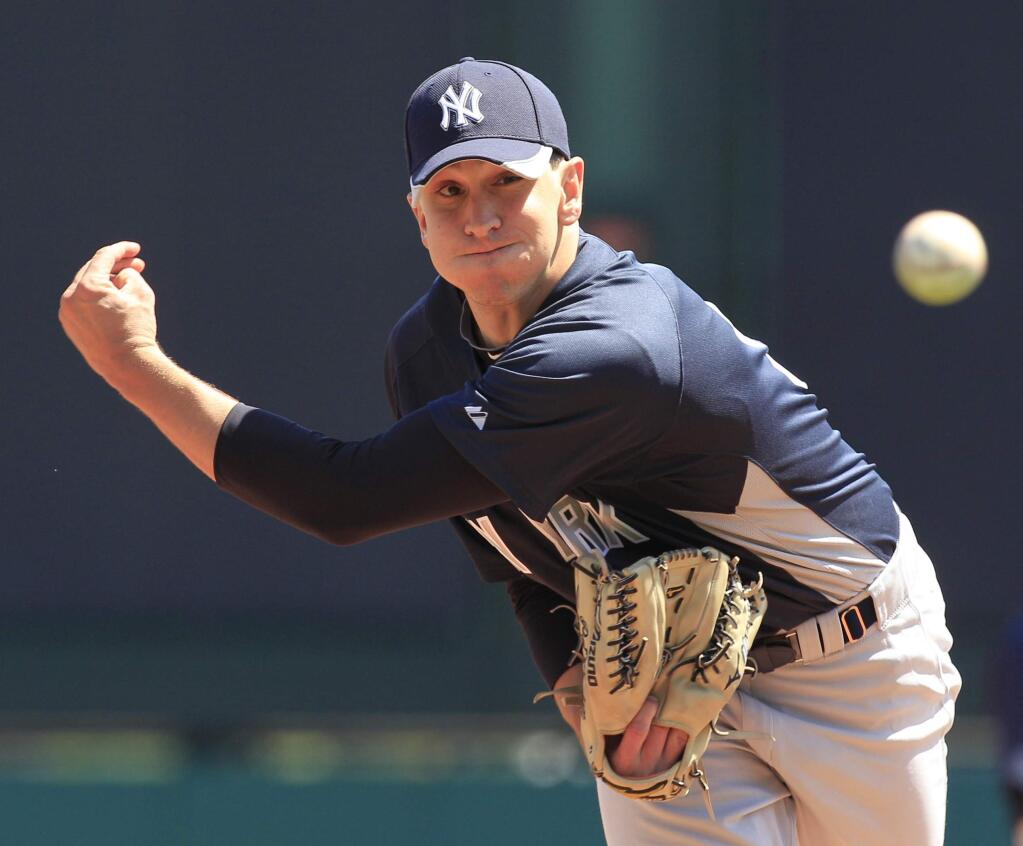 Then-Yankees pitcher Pat Venditte throws during the sixth inning of a spring training game against the Atlanta Braves Tuesday, March 30, 2010 in Kissimmee, Fla. (AP Photo/Charlie Riedel)