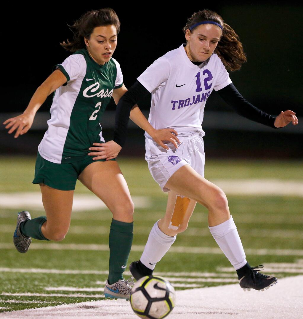 Casa Grande's Kaitlyn Banks (2), left, and Petaluma's Zoe Frothinger (12) vie for the ball during the first half of a girls varsity soccer match between Petaluma and Casa Grande high schools, in Petaluma, California, on Wednesday, January 30, 2019. (Alvin Jornada / The Press Democrat)