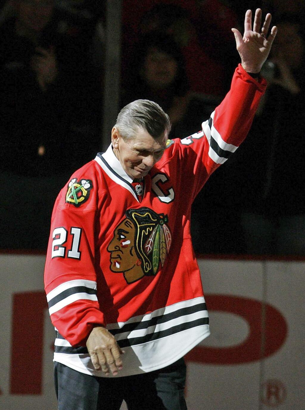 In this March 7, 2008, file photo, Chicago Blackhawks great Stan Mikita waves to fans as they as he is introduced before an NHL hockey game against the San Jose Sharks in Chicago. Mikita, who played for the Blackhawks for 22 seasons, becoming one of the franchise's most revered figures, has died, the Blackhawks announced Tuesday, Aug. 7, 2018. He was 78. (AP Photo/Brian Kersey, File)