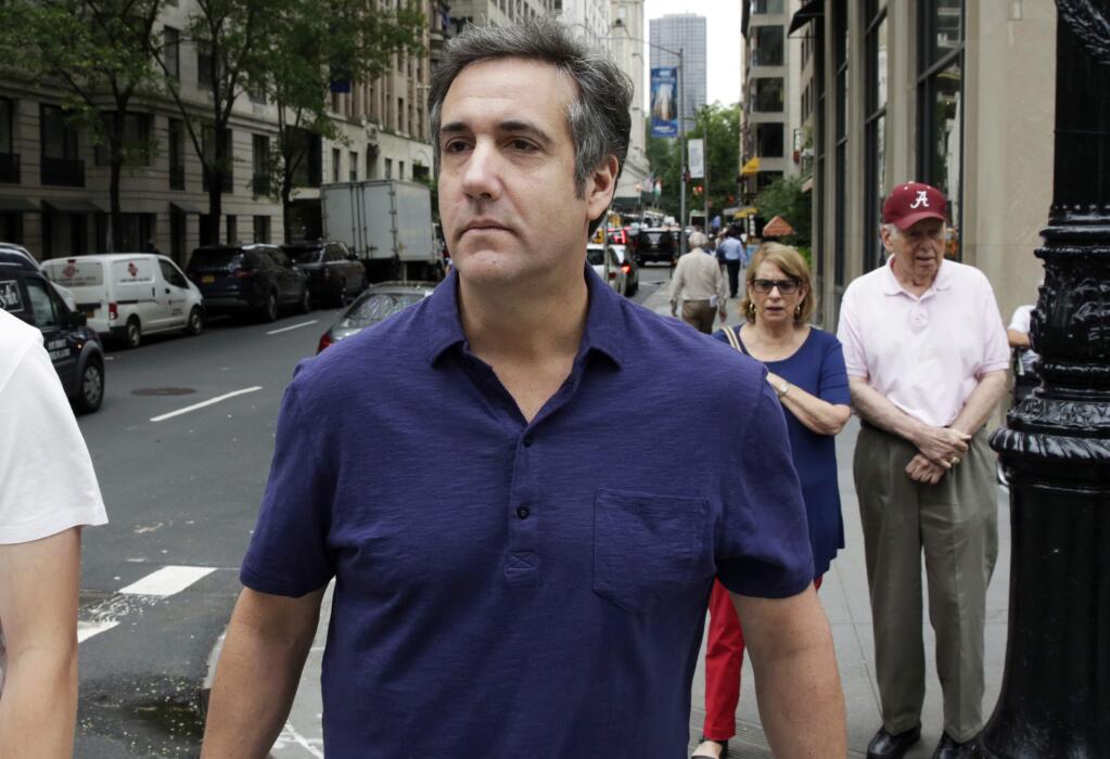 FILE - In a Monday, July 30, 2018 file photo, Michael Cohen, formerly a lawyer for President Trump, leaves his hotel, in New York. Attorney Barbara Jones revealed in a letter filed Thursday, Aug. 9, 2018, in Manhattan federal court that she has completed her review of designations by lawyers for attorney Michael Cohen, Trump and the Trump Organization. After the April 9 raid of Cohen's office and residences, Cohen asked a judge to give him a role in deciding what seized items were privileged and could not be seen by prosecutors. The judge appointed Jones. (AP Photo/Richard Drew, File)