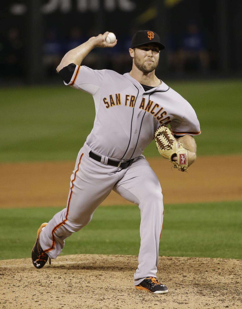 San Francisco Giants pitcher Hunter Strickland pitches during the ninth inning of Game 1 of the World Series against the Kansas City Royals Tuesday, Oct. 21, 2014, in Kansas City, Mo. The Giants defeated the Royals 7-1 to take the first game of the best-of-seven series. (AP Photo/Matt Slocum)